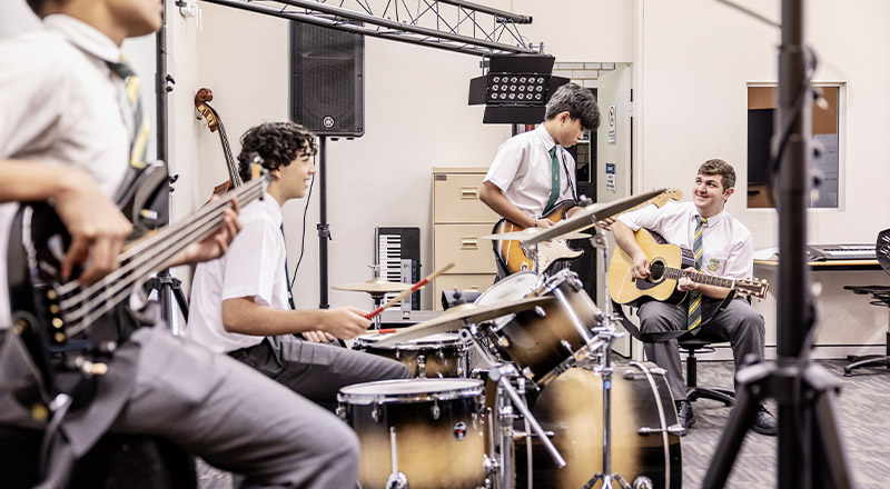 Students playing music together in the music room at Parramatta Marist High School Westmead