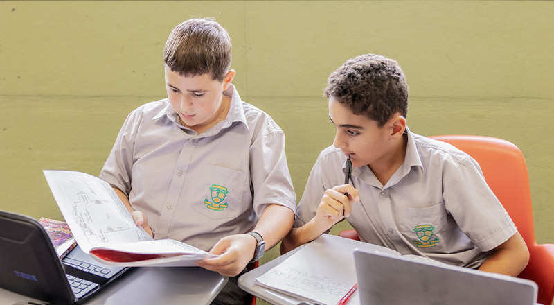 Students working together at their desk at Parramatta Marist High School Westmead