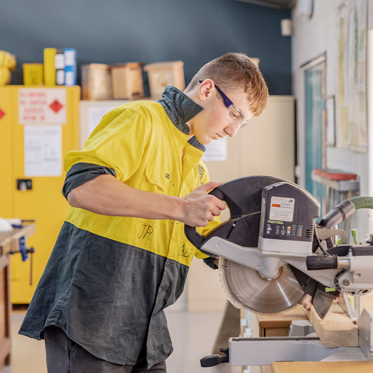 Student using the drop saw in the Innovation and Fabrication centre at Parramatta Marist High School Westmead