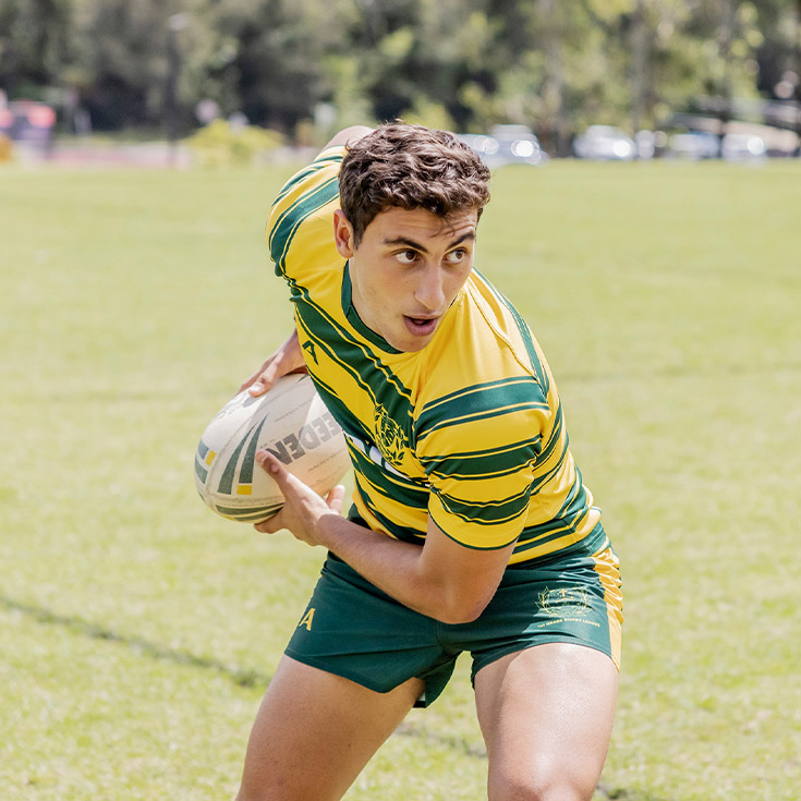 Student playing football at Parramatta Marist High School Westmead